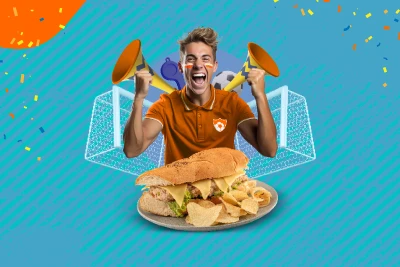 Fanático del fútbol y de los sandwiches celebrando acompañado de un sándwich
                        